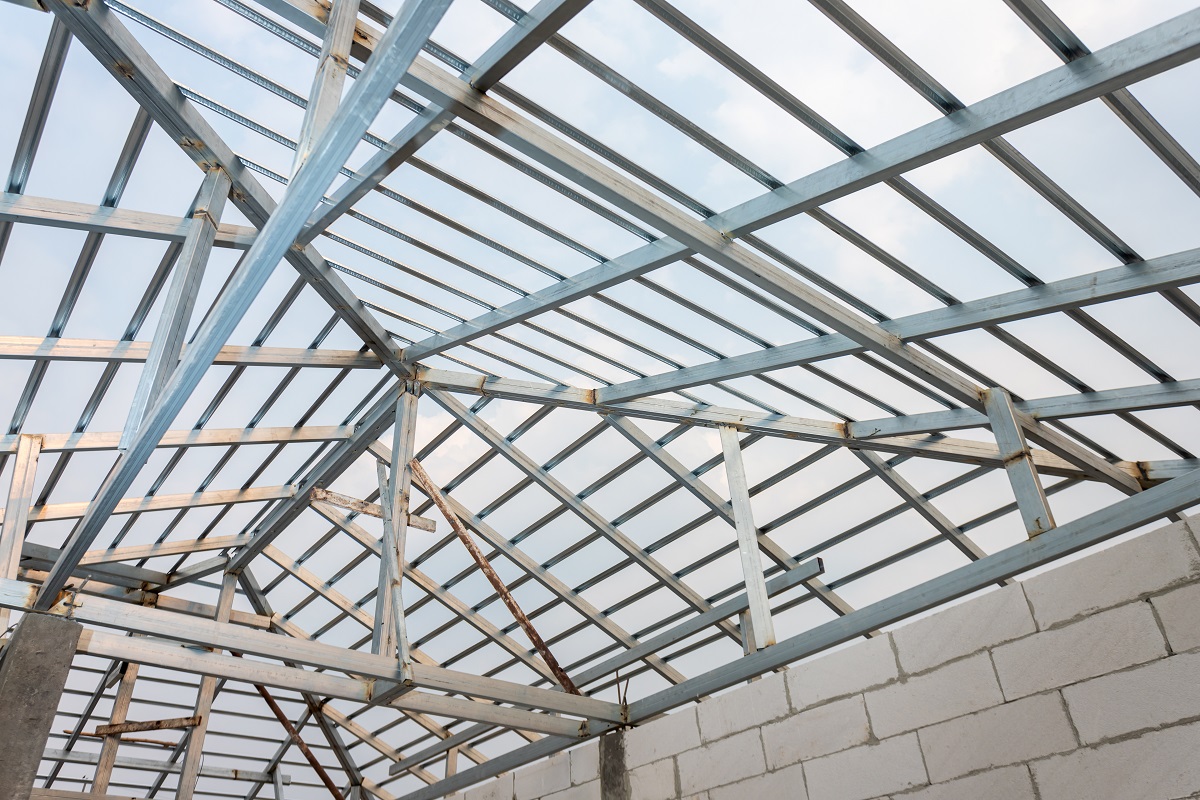 Structure of steel roof frame for home construction. Concept of Structure of steel roof frame for home construction. Concept of residential building under construction.